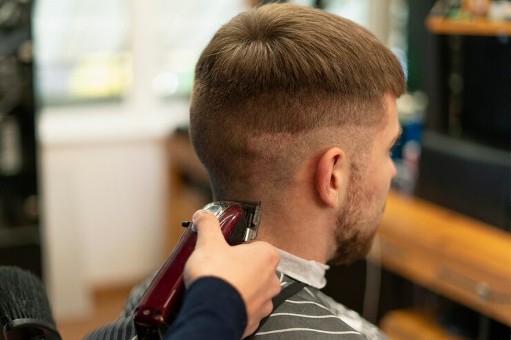 Close up man getting haircut Free Photo