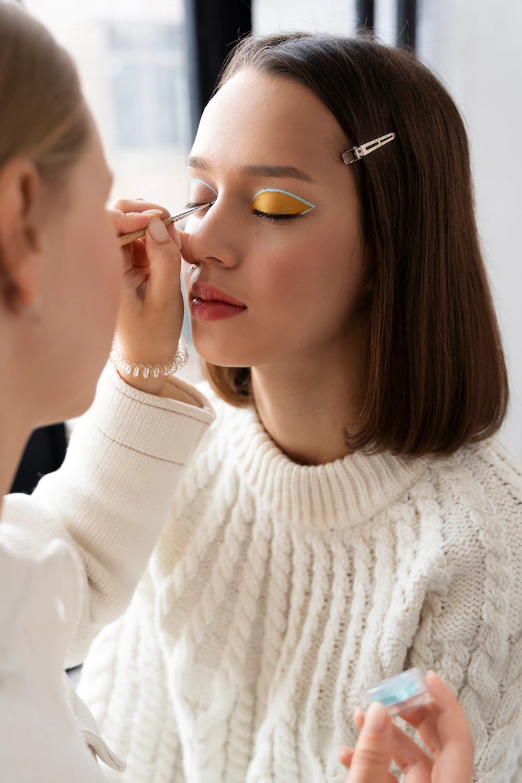 Close up woman wearing eyeshadow Free Photo