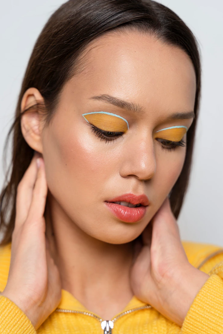 Close up woman wearing eyeshadow Free Photo