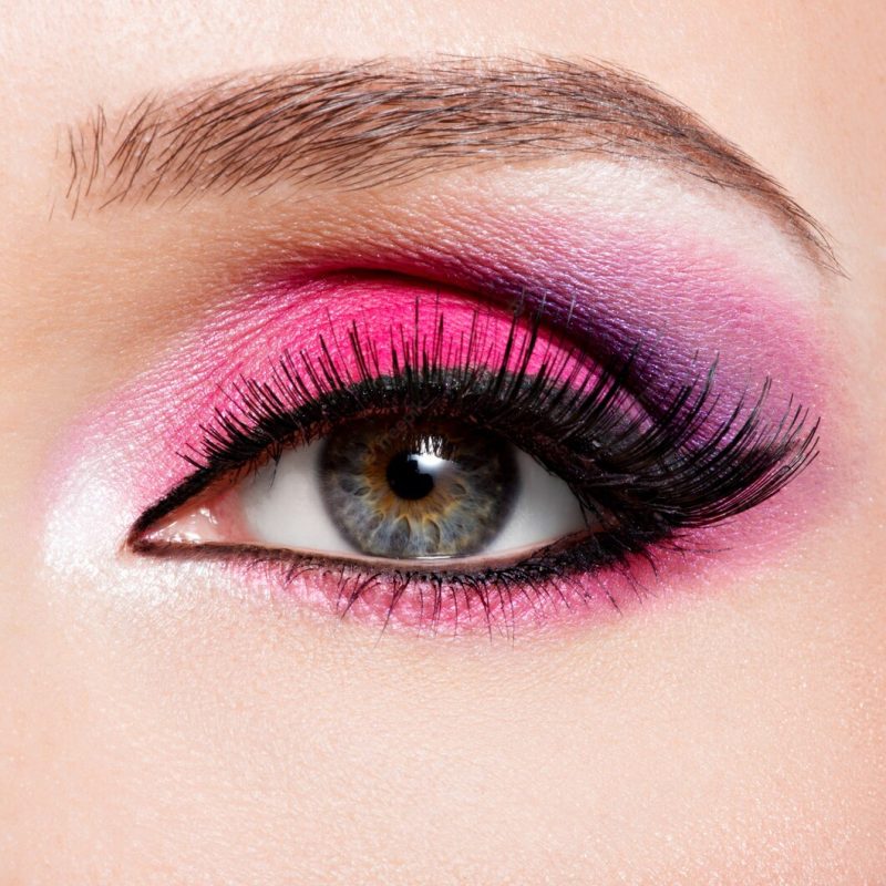 Closeup female eye with beautiful fashion bright pink makeup Free Photo