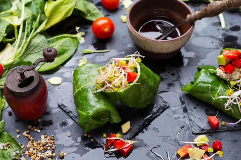 Closeup shot of a vegan wrap with red peppers and tomatoes Free Photo