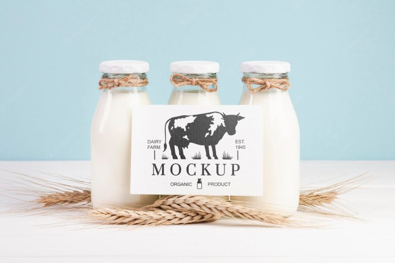 Dairy mock-up with milk bottles and placeholder Free Psd