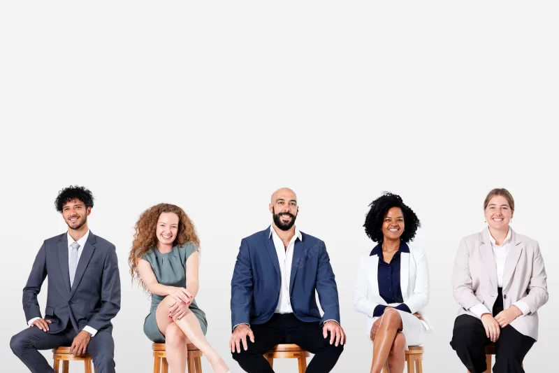 Diverse business people smiling while sitting jobs and career campaign Free Photo