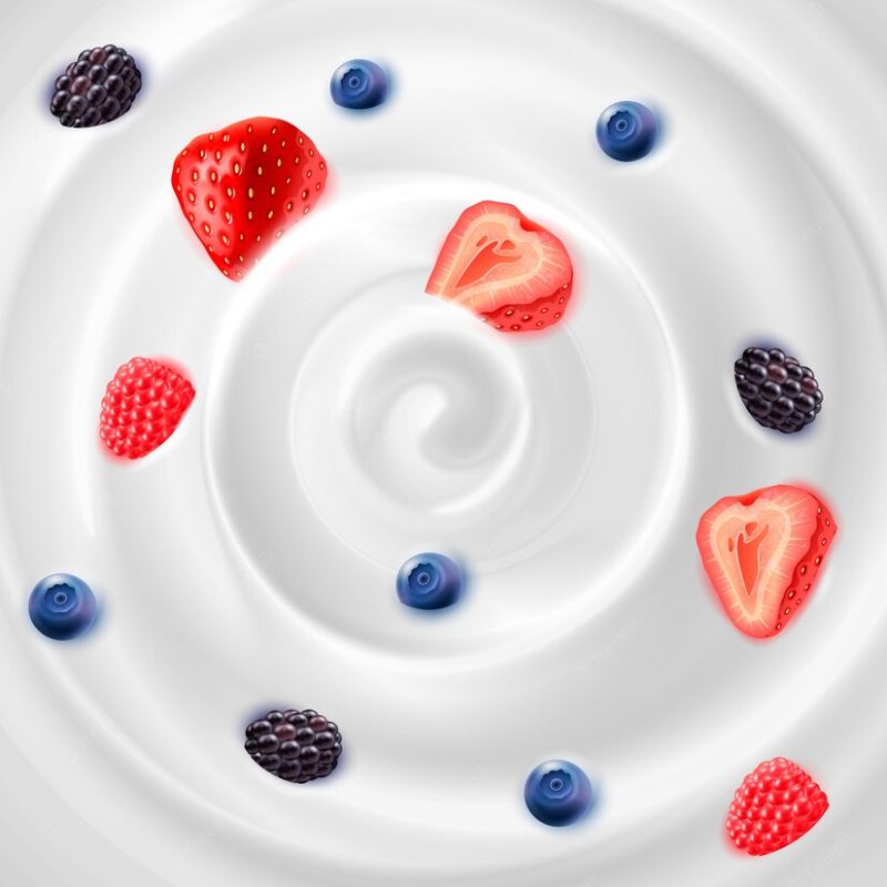 Food background representing light natural yogurt cream with strawberries blackberries and blueberrie