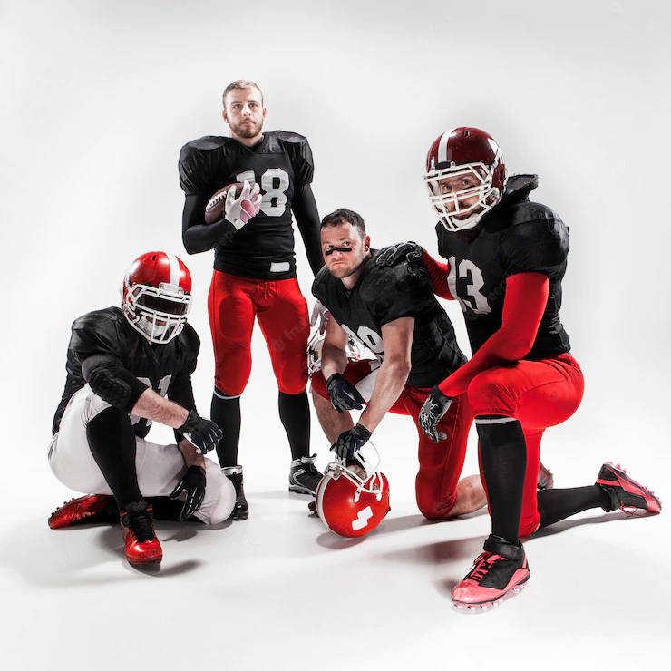 Four American Football Players Posing With Ball White Space 155003 12497