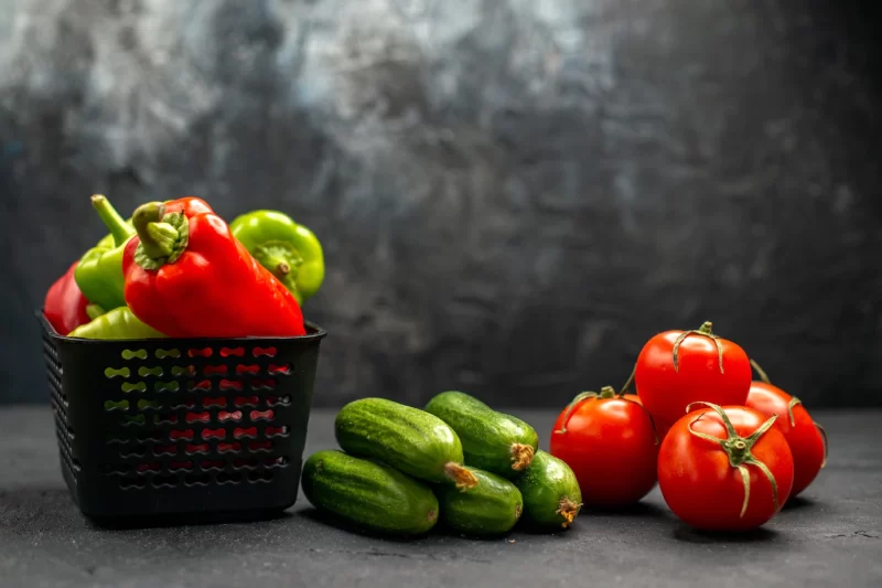 Front view fresh red tomatoes with cucumbers on a dark background ripe meal color photo salada Free Photo