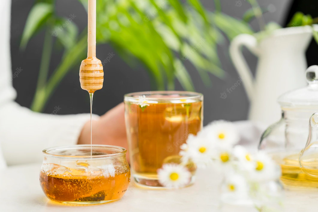 Front View Person Holding Glass With Tea Honey Dipper 23 2148567536