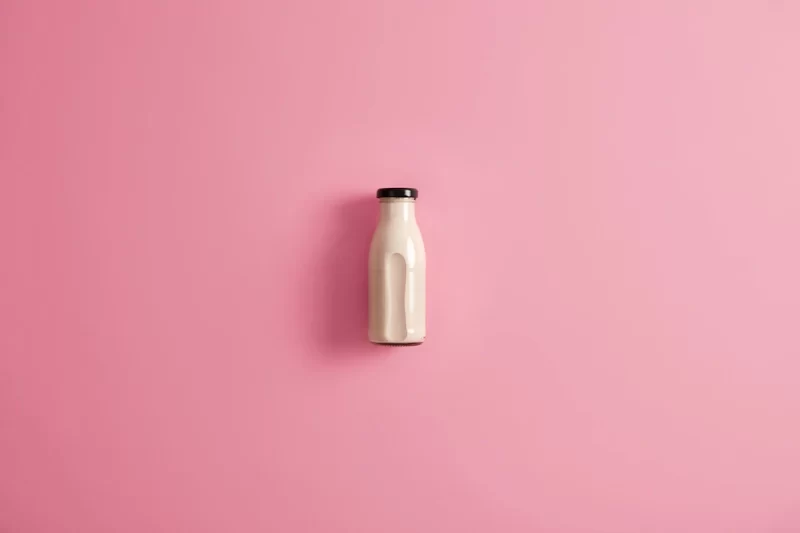 Glass bottle of plant based lactose free vegetarian white milk for your healthy nutrition. homemade organic nutrient beverage made of coconut, soybean, oat or cashew. fresh alternative drink Free Photo