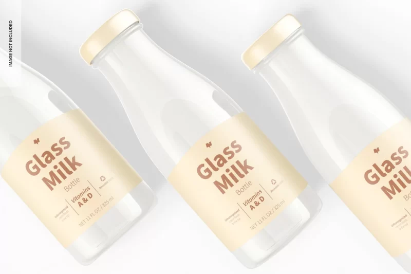 Glass milk bottles mockup, close up Free Psd