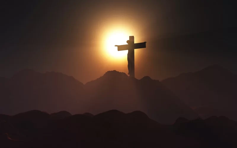 Good Friday Jesus on the cross in a sunset Free Photo