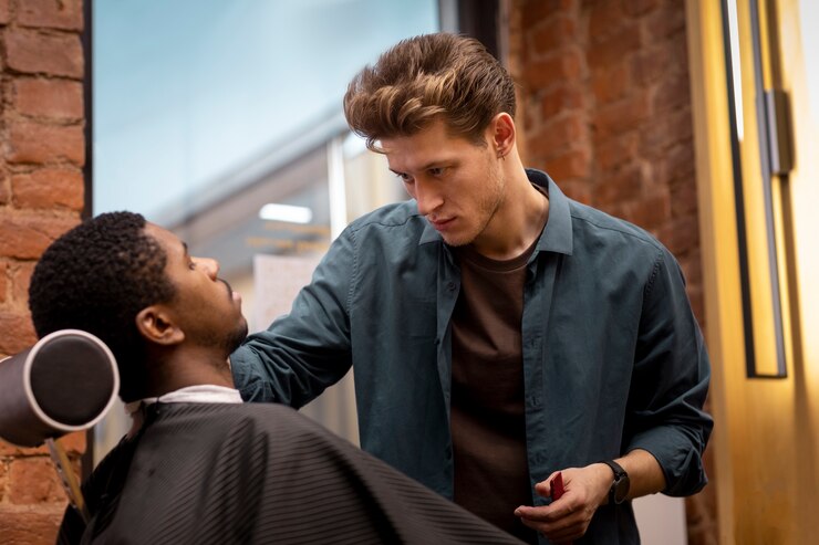 Hairdresser grooming their client Free Photo