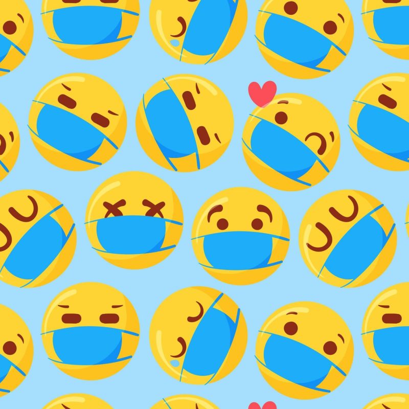 Hand drawn emoji with face mask pattern Free Vector