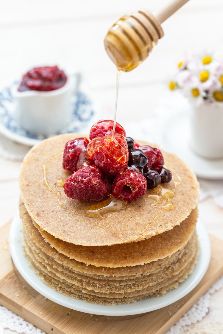 High Angle Vertical Closeup Shot Raw Vegan Pancakes With Honey Berries 181624 26593