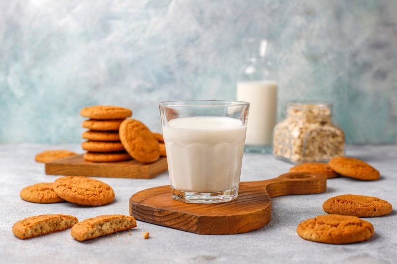 Homemade oatmeal cookies with a cup of milk. Free Photo