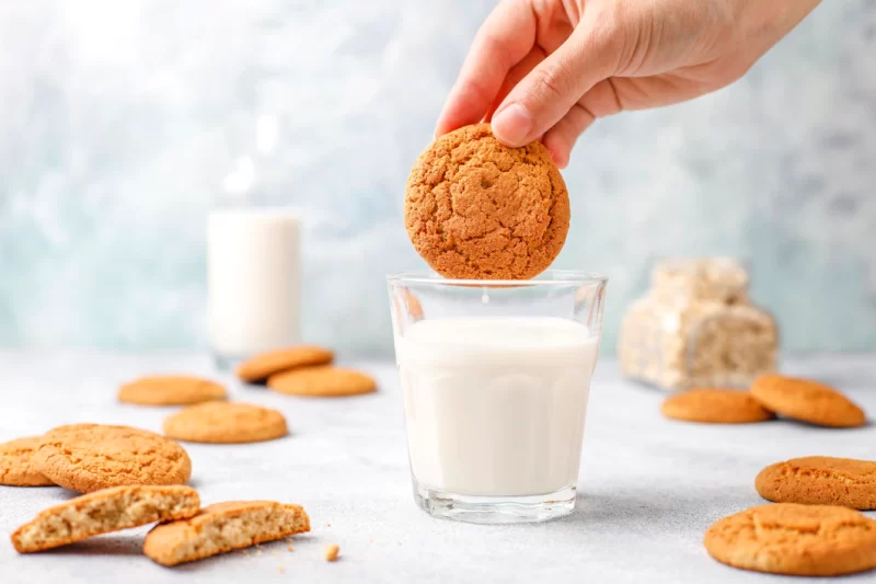 Homemade oatmeal cookies with a cup of milk. Free Photo