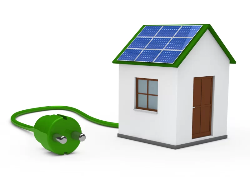 House with a solar panel and a green plug Free Photo