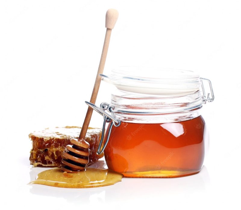 Jar with fresh honey Free Photo