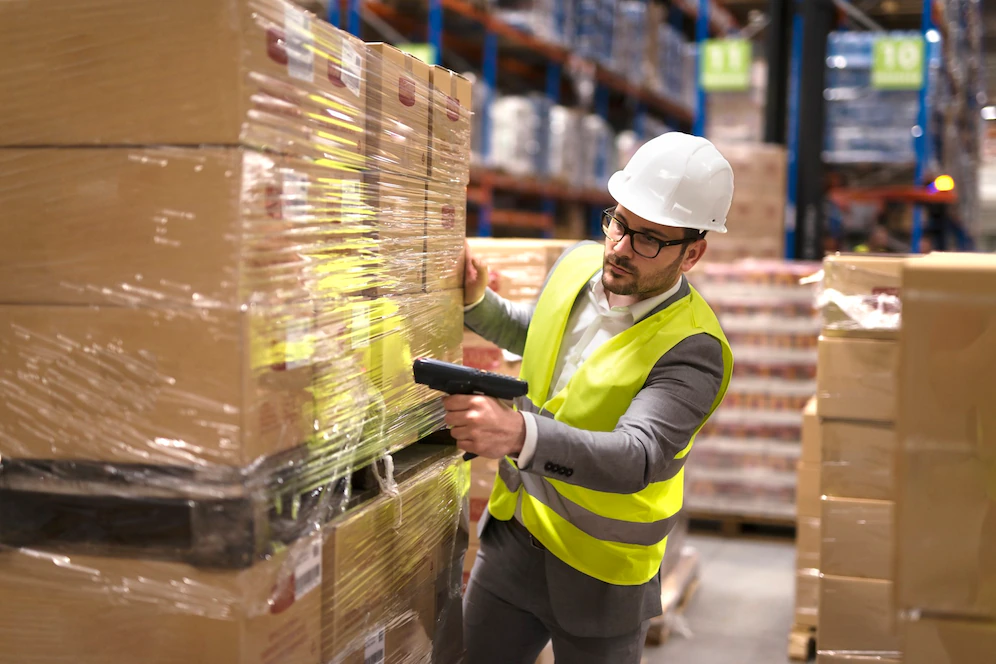 Male Warehouse Worker Using Bar Code Scanner Analyze Newly Arrived Goods Further Placement Storage Department 342744 1486