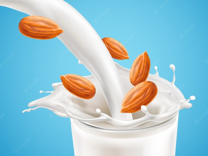 Milk plashing effect with liquid pouring down in glass cup Premium Vector