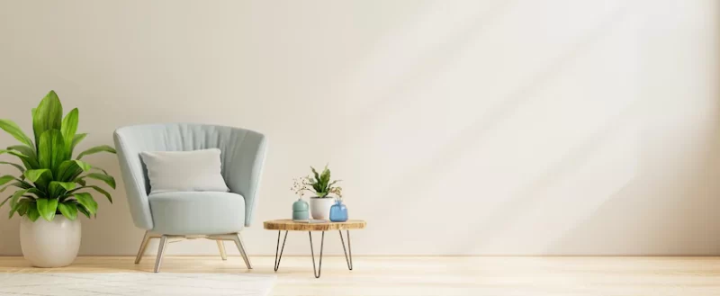 Modern living room interior with armchair and decorating ideas on white wall background.3d rendering Free Photo