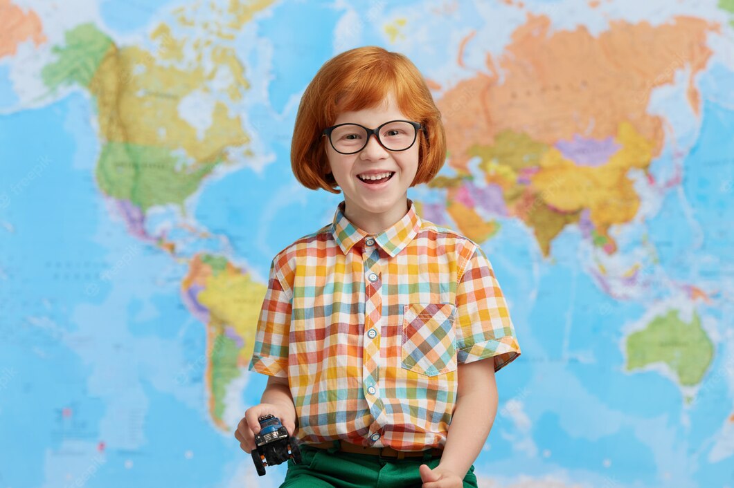 Portrait Playful Red Haired Little Boy Colorful Clothes Holding Toy Car Hands Having Good Mood While Going Kindergarten Funny Redhead Boy Posing Against World Map Children School 273609 611