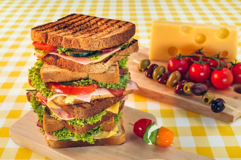 Selective focus shot of sandwiches and vegetables Free Photo