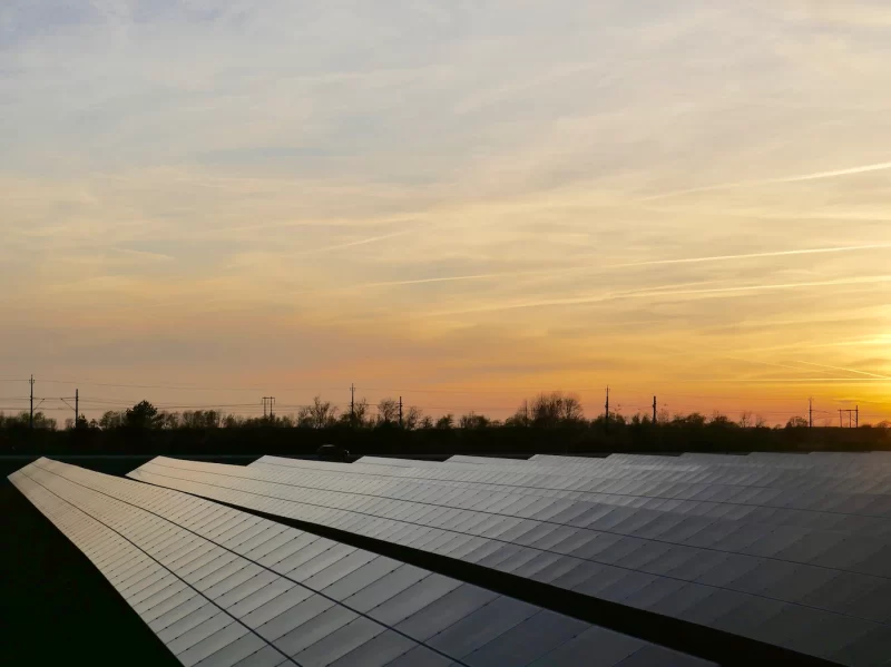 Solar power station surrounded by trees Free Photo