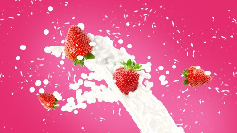 Strawberry milkshake splash background Free Photo