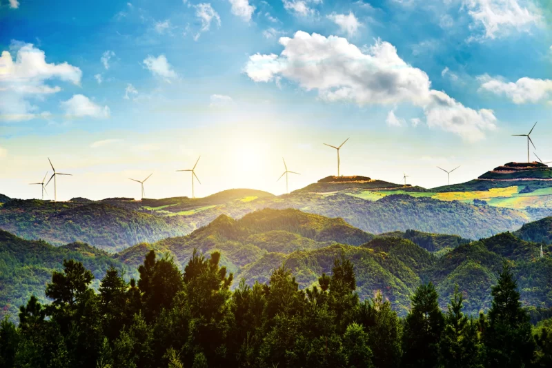 Sunny landscape with windmills Free Photo