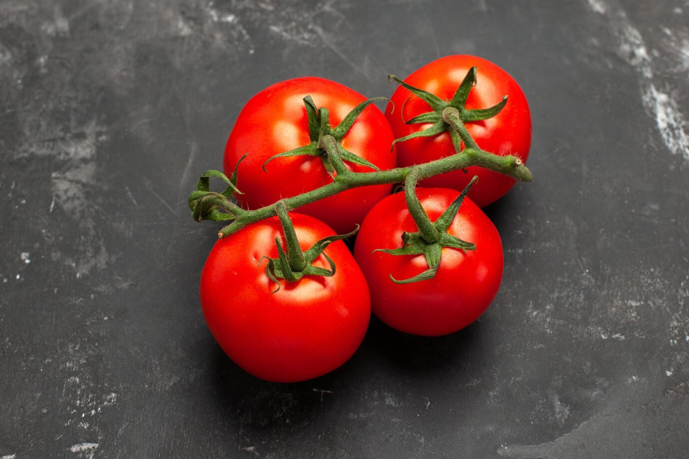 Top Close Up View Tomatoes Four Appetizing Ripe Tomatoes With Stalks Black Table 140725 123494