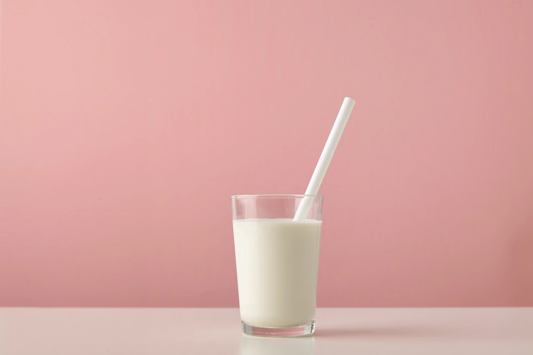 Transparent Glass With Fresh Organic Milk White Drinking Straw Inside Isolated Pastel Pink Background Wooden Table 346278 831