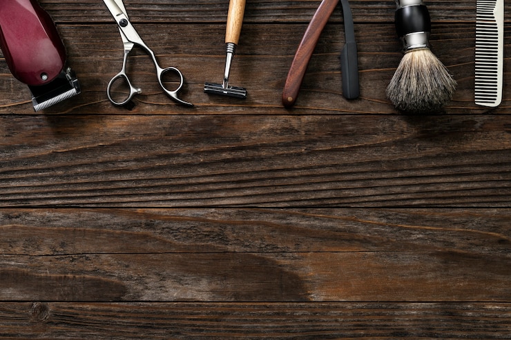 Vintage border salon tools on a wooden table in jobs and career concept Free Photo