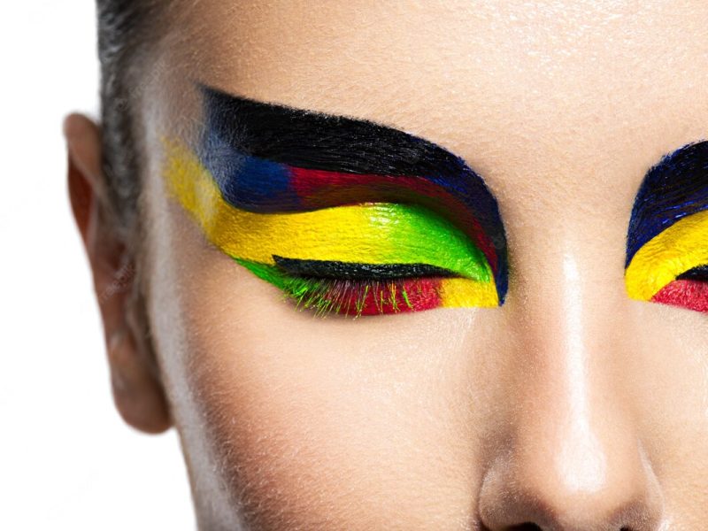 Woman’s eye with vivid colors makeup. macro image Free Photo