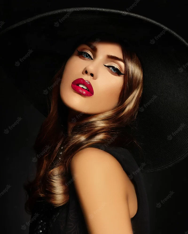 Young woman with bright makeup and black hat Free Photo