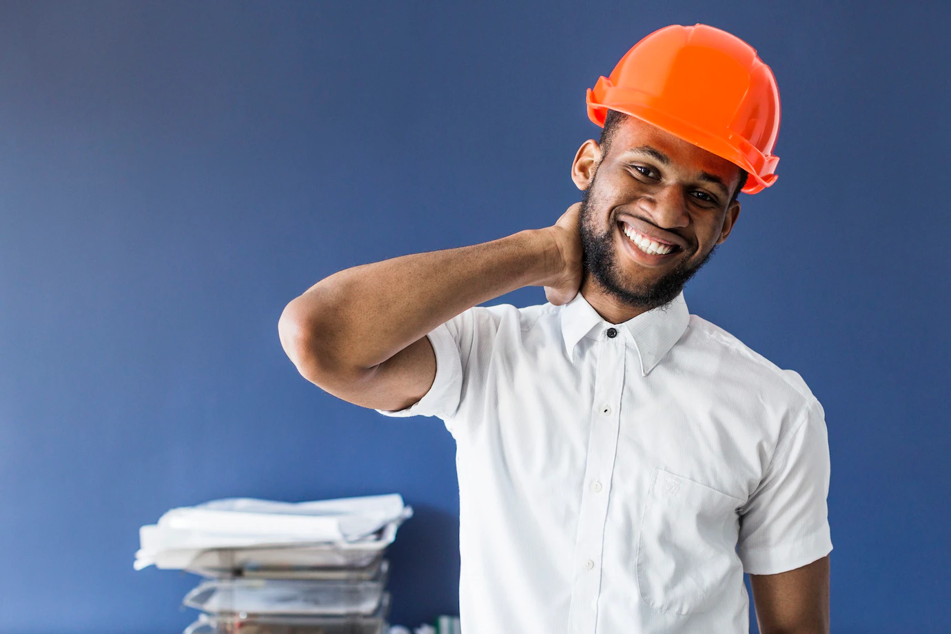 African American Male Architect Standing Against Blue Wall Workplace 23 2147843003