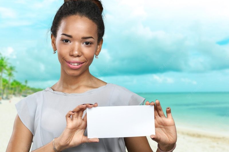 African American woman holding blank paper Free Photo