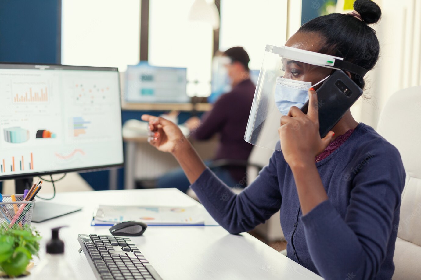 African Freelancer Discussing Smartphone About Financial Graphs Wearing Face Mask During Coronavirus 482257 2007