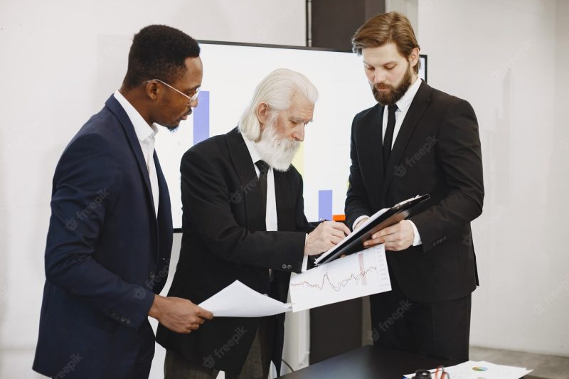 African man in a black suit. Free Photo