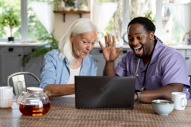 African social worker taking care of a senior woman Free Photo