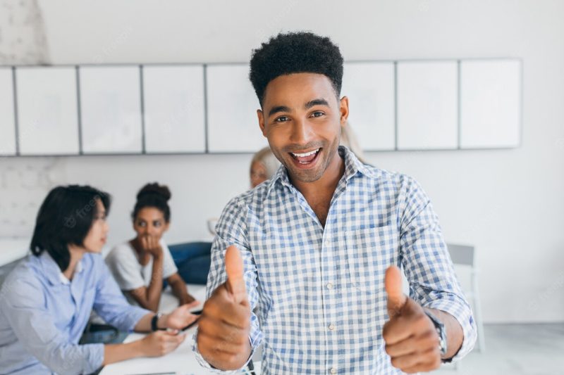 African student passed exams and having fun with university mates. international office workers discussing about new company goals. Free Photo