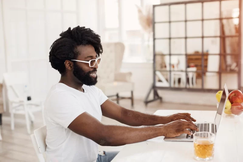 Afro man working at home Free Photo