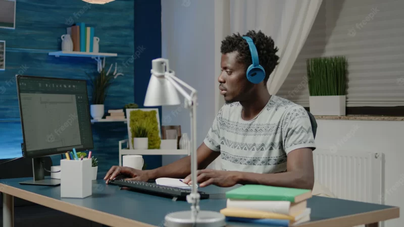 Black man working as engineer with architectural software on computer Free Photo