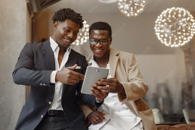 Black men in a cafe have a business Free Photo