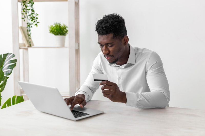 Business African American man working on mobile phone Free Photo