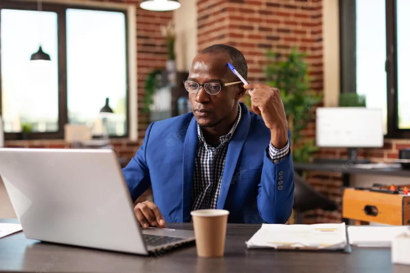 Business man thinking about innovative solution and planning project on laptop. pensive entrepreneur brainstorming financial ideas to plan marketing strategy on computer for startup. Free Photo