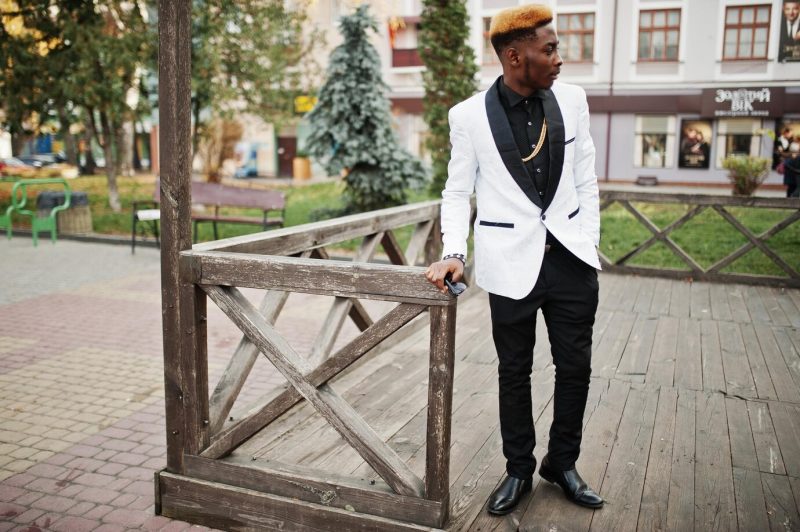 Chic handsome African American man in white suit Free Photo