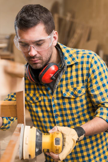 Close Up Male Carpenter Work Polishing Wood Using Orbit Sander 23 2147944883