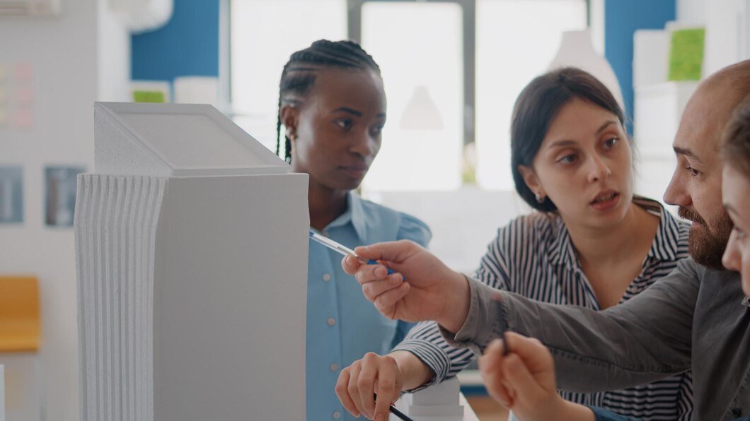 Close Up People Working With Building Model Analyze Maquette Construction Plan Colleagues Doing Teamwork Design Blueprints Looking Urban Real Estate Project 482257 29929