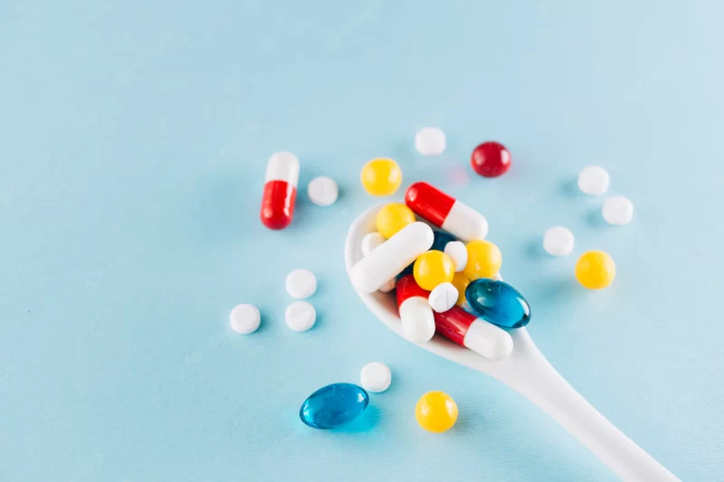 Colorful pills on spoon Free Photo Colorful pills on spoon Free Photo