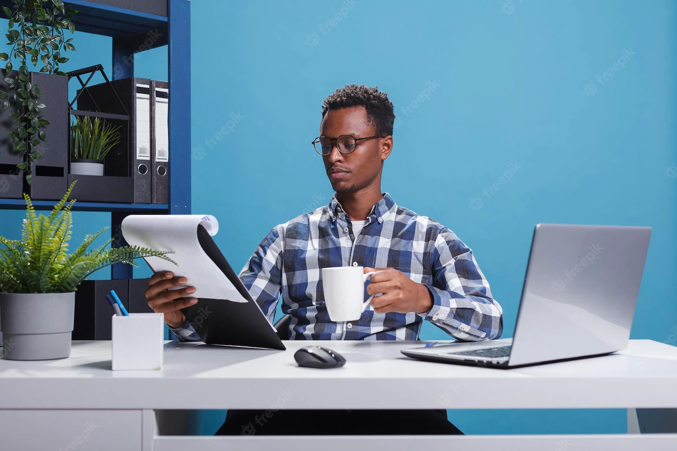 Company Office Worker Having Documentation Clipboard Coffee Cup Looking Project Management Charts Young African American Employee Sitting Modern Workspace While Reviewing Paperwork 482257 40366